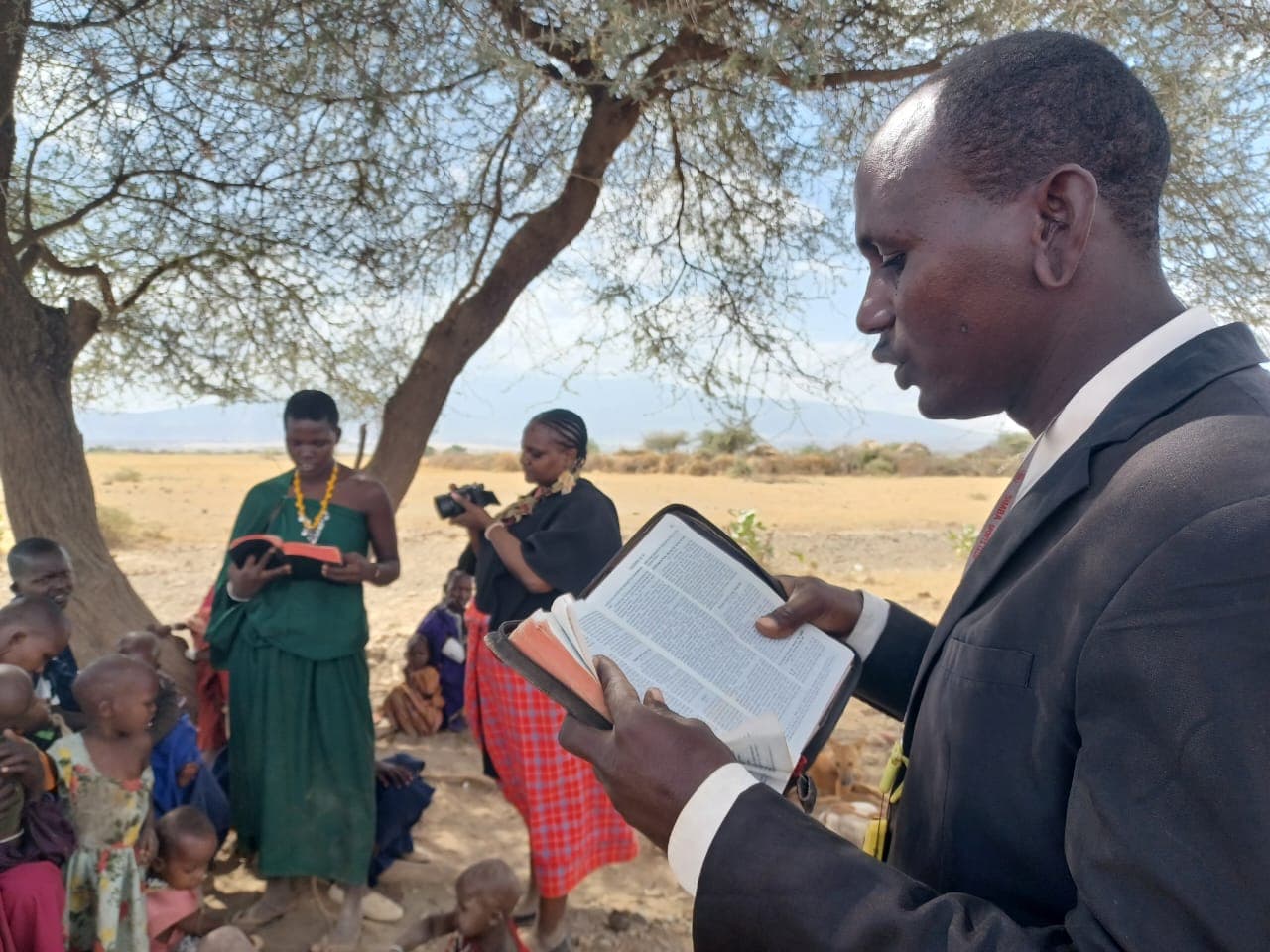 Documentary crew with community members in Tanzania